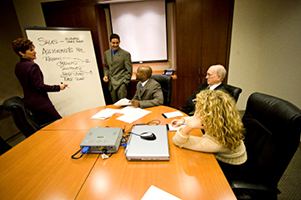 Image of a boardroom-style brainstorming group